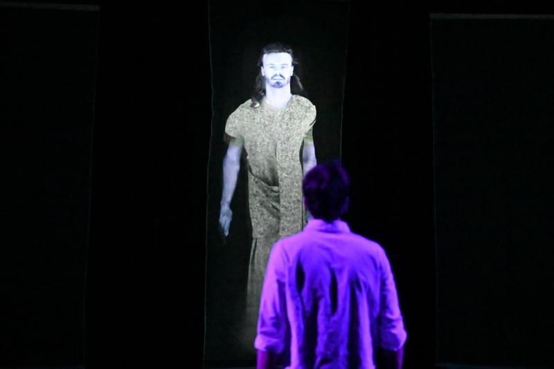 A giant projection of Hamlet's Father in 'Hamlet'