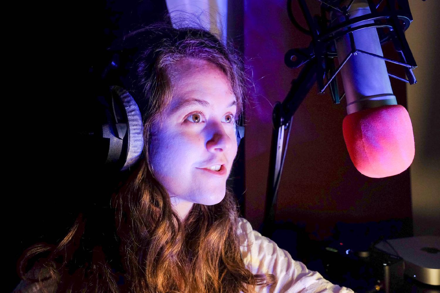 "Rae Emily George in a studio recording commercial voiceover"
